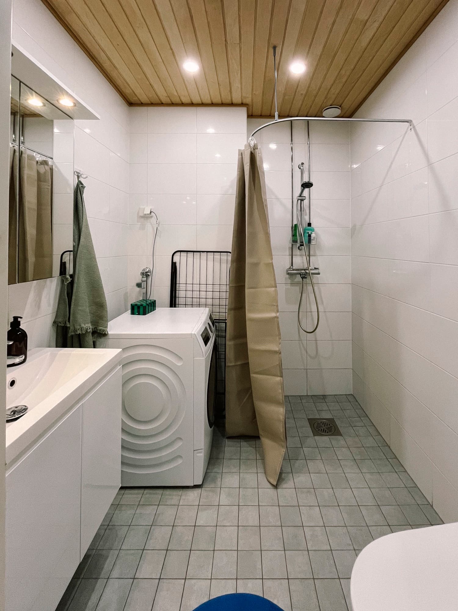 Bathroom with walk-in shower and laundry