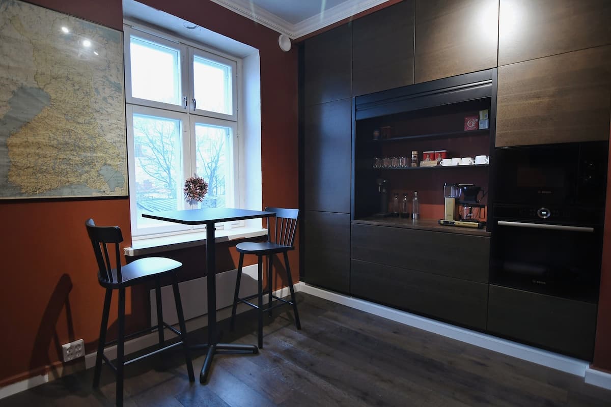 Kitchen coffee station with Bosch appliances and bar seating